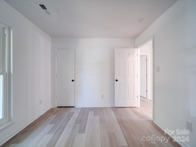 empty room with light wood-type flooring