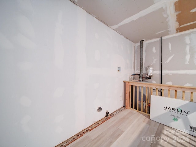 basement featuring hardwood / wood-style flooring