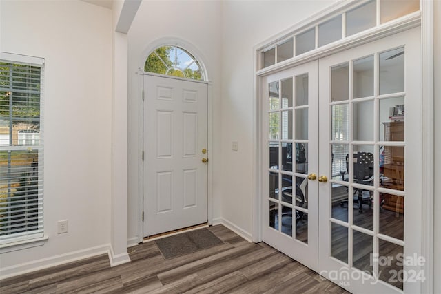 foyer entrance featuring french doors and hardwood / wood-style floors