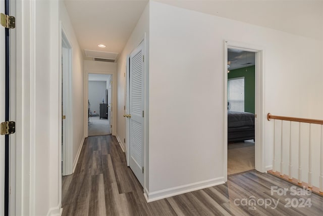 hall with dark hardwood / wood-style flooring