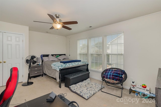 bedroom featuring ceiling fan and carpet floors