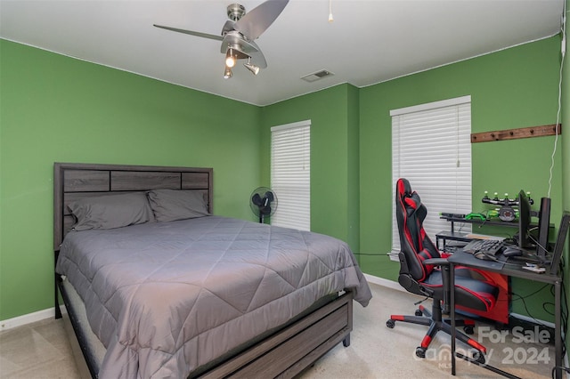 bedroom featuring ceiling fan and light colored carpet