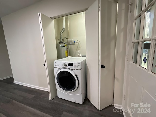 laundry room featuring water heater, dark hardwood / wood-style flooring, and washer / dryer