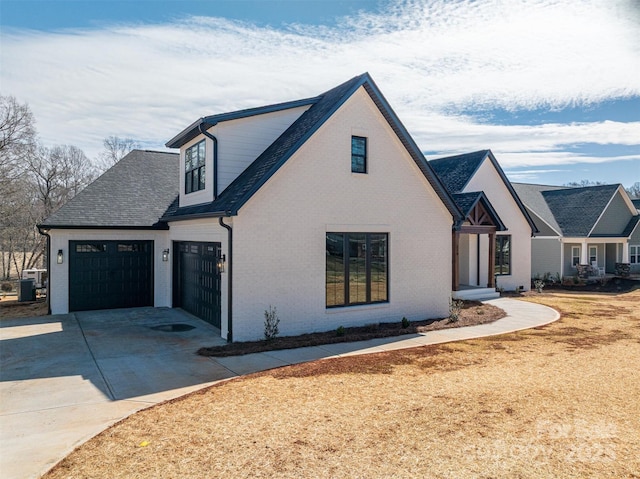 modern inspired farmhouse featuring brick siding, driveway, an attached garage, and central AC unit