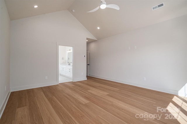 interior space with light wood-style flooring, visible vents, ceiling fan, and baseboards