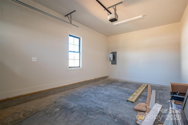 garage featuring electric panel, baseboards, and a garage door opener