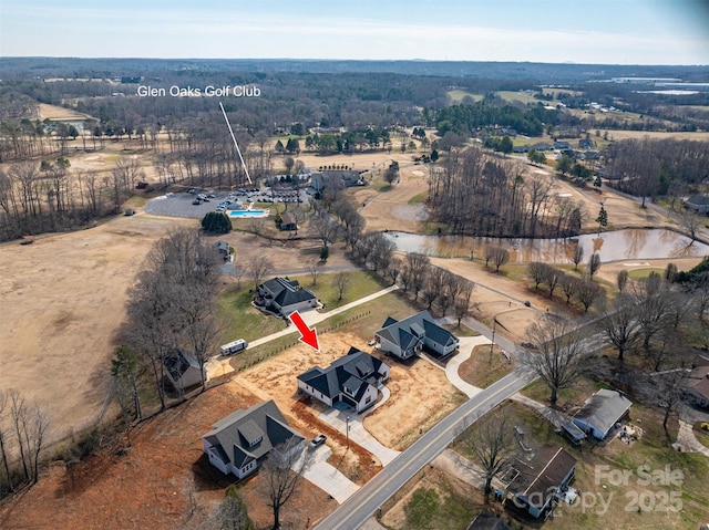 birds eye view of property featuring a rural view