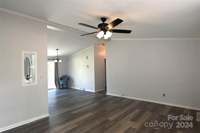 unfurnished living room with a textured ceiling, vaulted ceiling, ornamental molding, dark wood-type flooring, and ceiling fan with notable chandelier