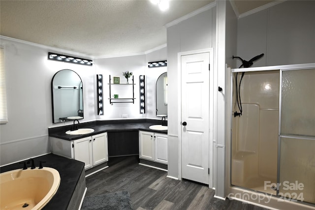 bathroom featuring independent shower and bath, a textured ceiling, vanity, crown molding, and hardwood / wood-style flooring