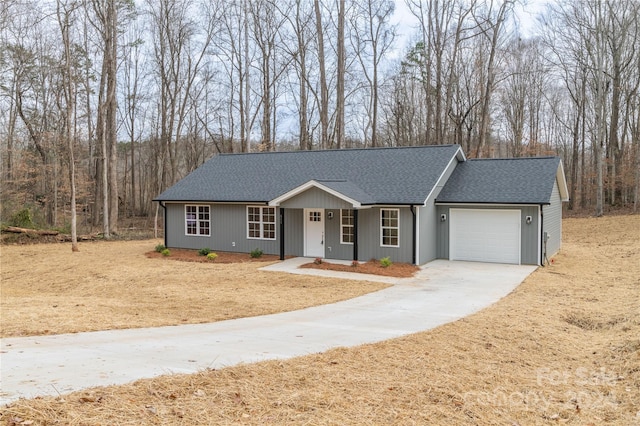 ranch-style home featuring a porch and a garage