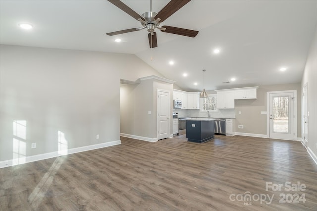 unfurnished living room featuring ceiling fan, sink, lofted ceiling, and hardwood / wood-style flooring