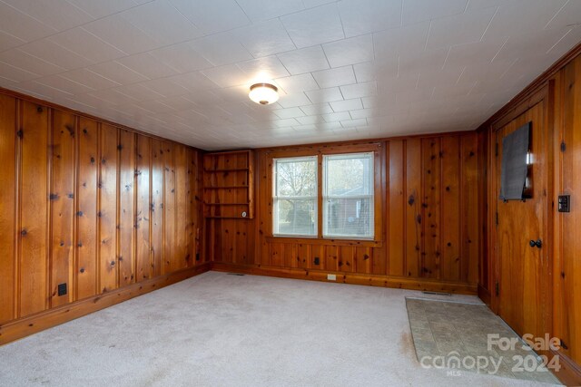 24947 Nc-24/27 Hwy, Albemarle, NC 28001 - unfurnished room featuring carpet floors and wood walls