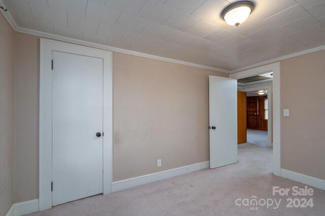 24947 Nc-24/27 Hwy, Albemarle, NC 28001 - unfurnished bedroom featuring carpet floors and crown molding