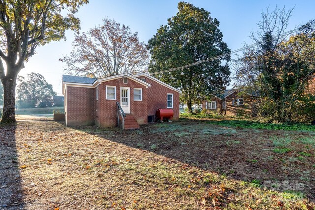 24947 Nc-24/27 Hwy, Albemarle, NC 28001 - view of property exterior with brick siding and oil tank