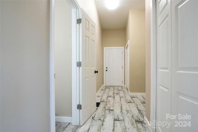 hallway featuring light wood-type flooring