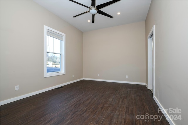 unfurnished room with dark hardwood / wood-style floors and ceiling fan