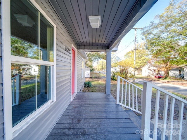 wooden terrace featuring a porch