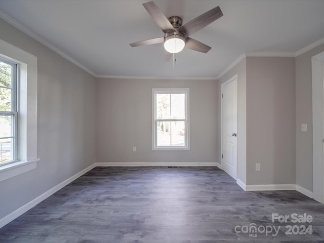 empty room with crown molding, ceiling fan, and dark wood-type flooring