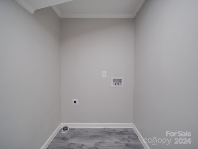 laundry room featuring hookup for an electric dryer, hookup for a washing machine, light hardwood / wood-style floors, and ornamental molding