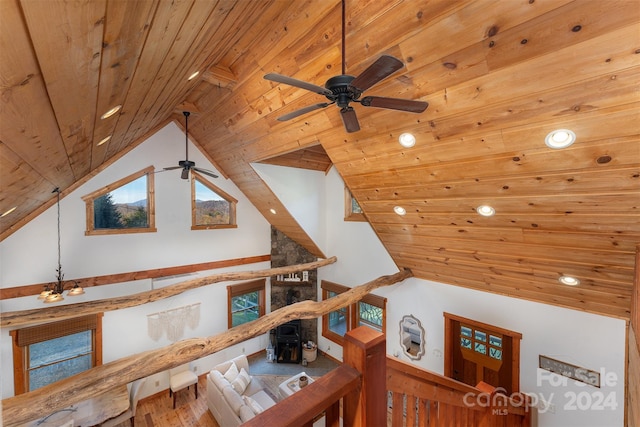 interior details with wood ceiling, beam ceiling, and ceiling fan