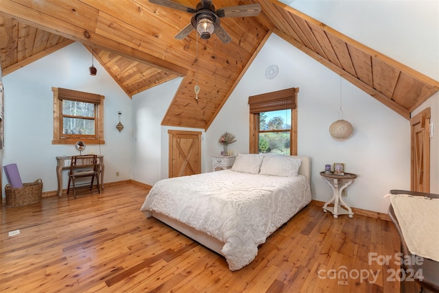 bedroom with light hardwood / wood-style flooring, wooden ceiling, lofted ceiling, and ceiling fan