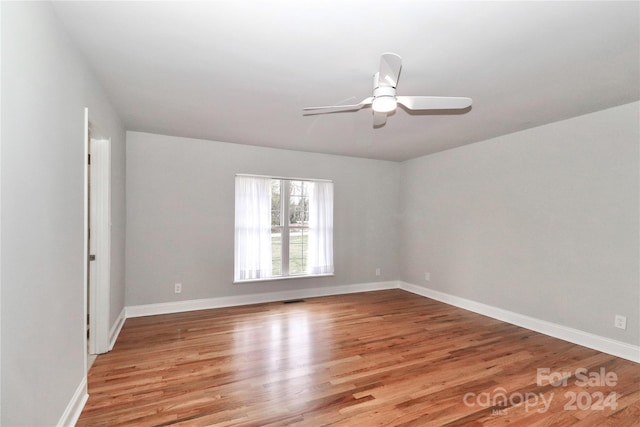 unfurnished room with ceiling fan and light hardwood / wood-style flooring