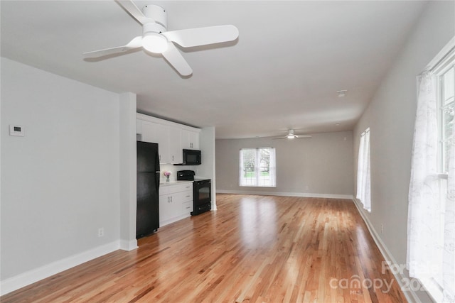 unfurnished living room with ceiling fan and light hardwood / wood-style floors