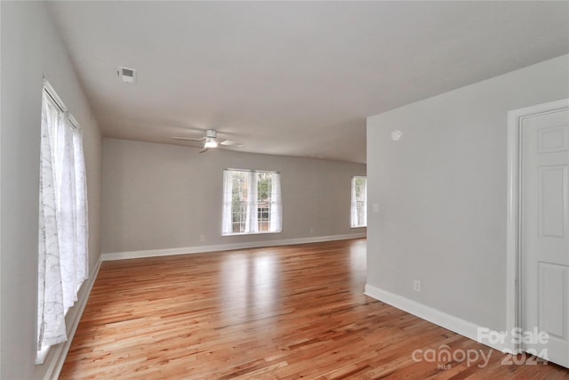 unfurnished room with light hardwood / wood-style flooring and ceiling fan