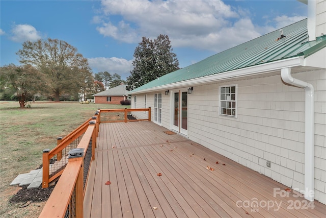 wooden deck with a yard