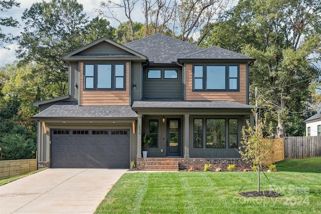 view of front facade featuring a front lawn and a garage