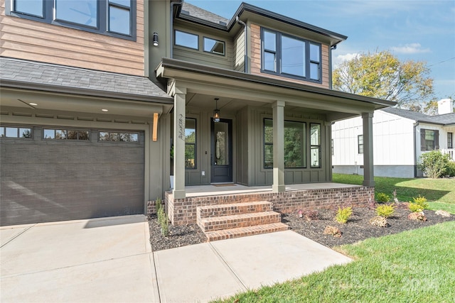 view of exterior entry with covered porch