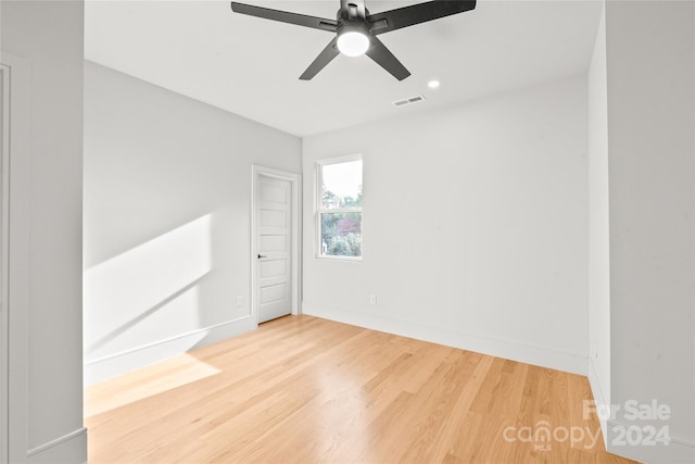 unfurnished room featuring ceiling fan and wood-type flooring