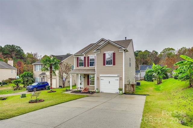 view of front of home featuring a front lawn and a garage