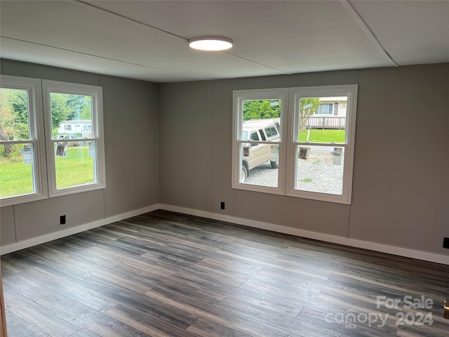 spare room featuring dark hardwood / wood-style flooring