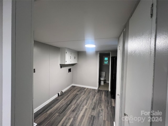 washroom with cabinets and dark hardwood / wood-style flooring