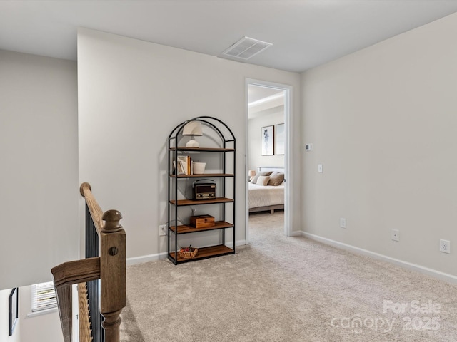 interior space featuring light colored carpet