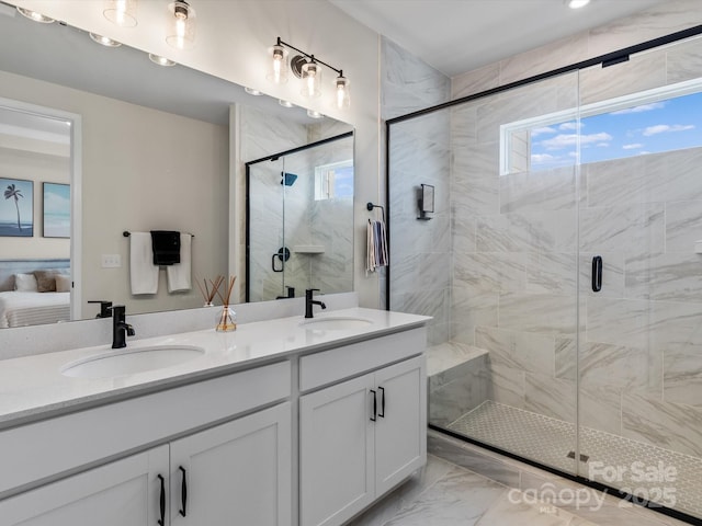 bathroom with walk in shower and vanity