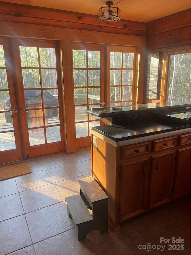 kitchen with dark tile patterned floors