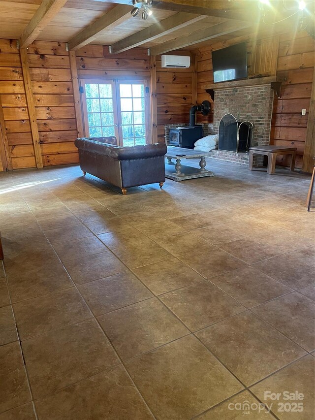 living room with a wood stove, an AC wall unit, beamed ceiling, and wood walls