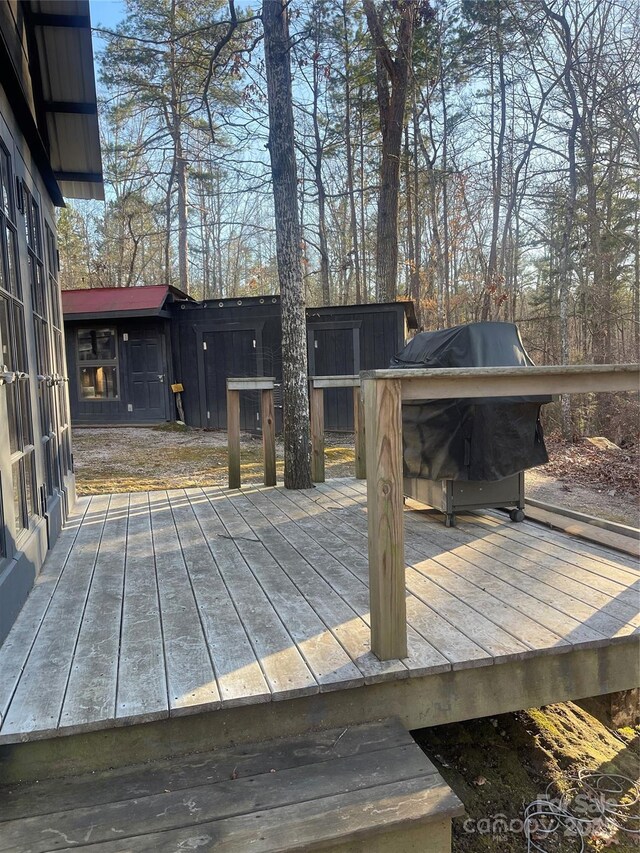 wooden deck with grilling area