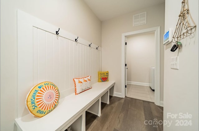 mudroom with dark hardwood / wood-style floors