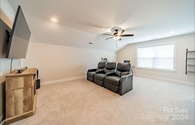 carpeted cinema featuring lofted ceiling and ceiling fan