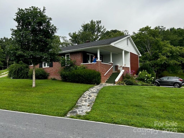 view of front of house featuring a front lawn and a porch