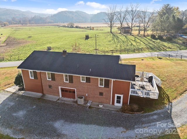 birds eye view of property featuring a rural view and a mountain view