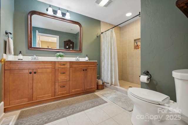 bathroom with tile patterned floors, toilet, a shower with curtain, and vanity