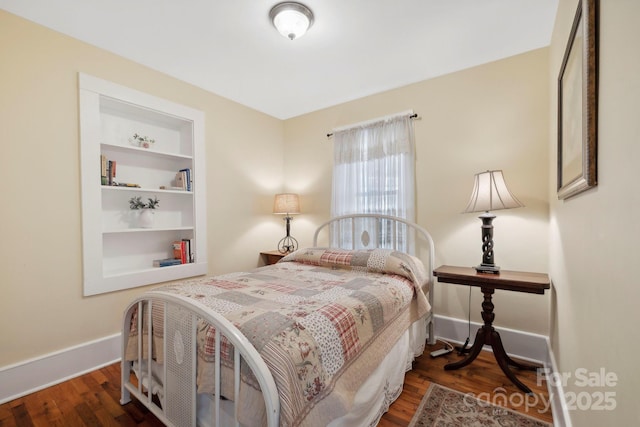 bedroom featuring dark hardwood / wood-style floors