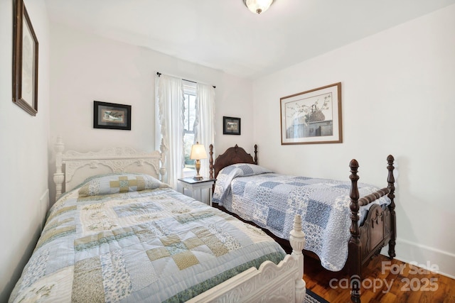 bedroom with hardwood / wood-style flooring