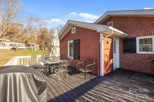 wooden deck with grilling area