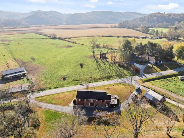 aerial view with a mountain view and a rural view