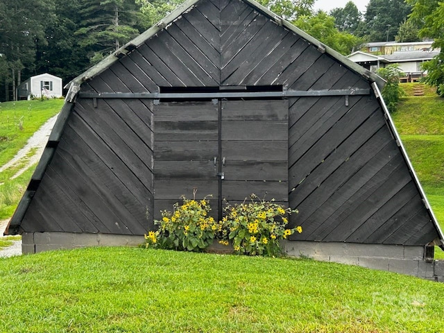 view of outdoor structure with a lawn